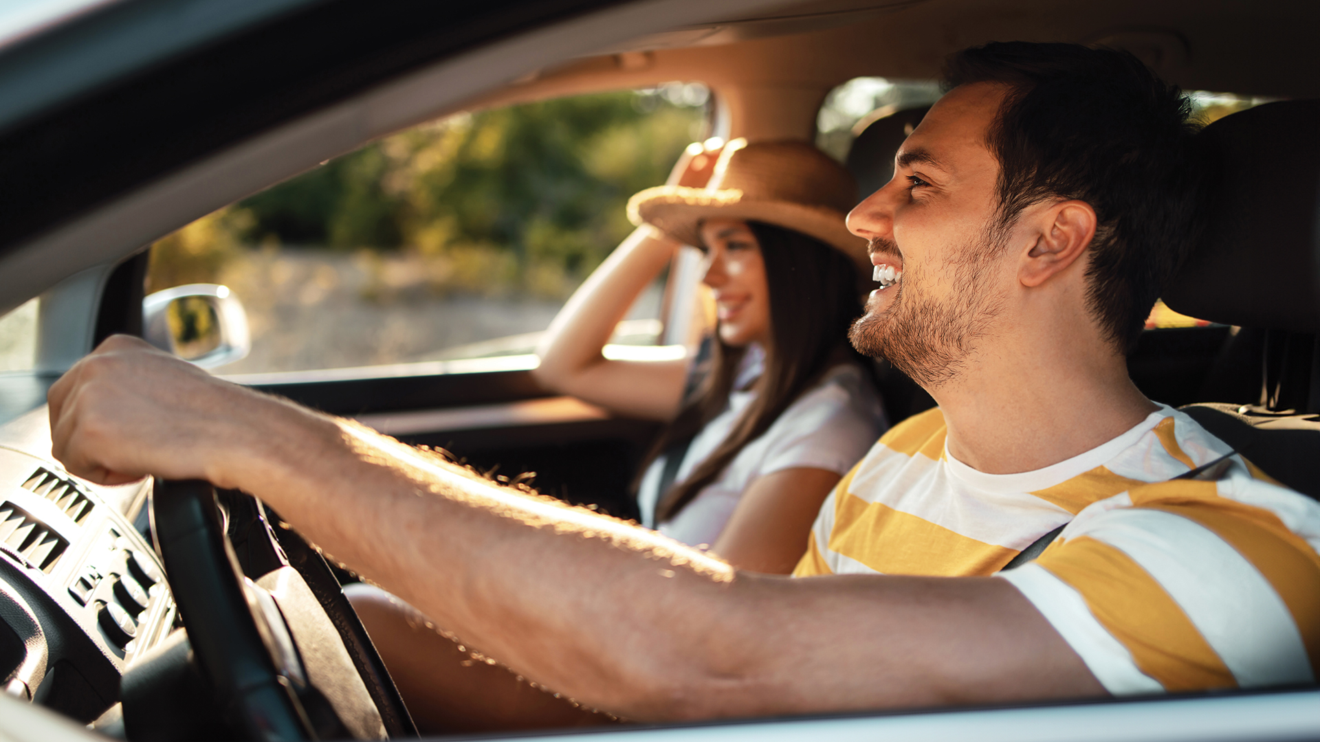 Shot of a young couple enjoying a road trip together